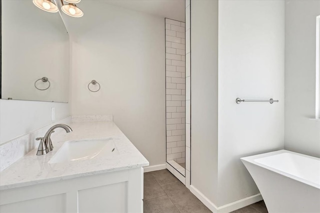 1069 Rheagen Kay Ave, Tuttle, OK 73089 - full bath featuring a freestanding tub, vanity, tile patterned floors, and a tile shower