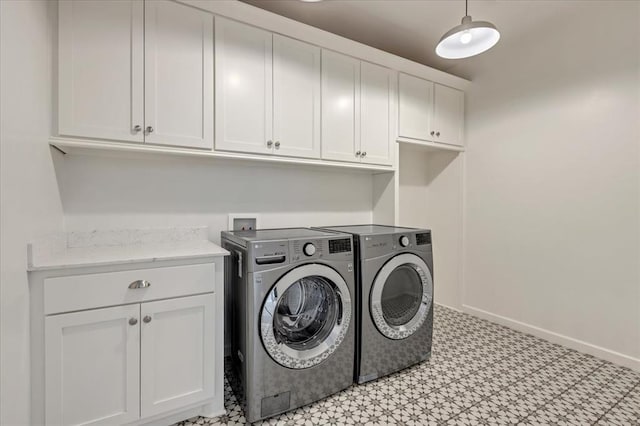1069 Rheagen Kay Ave, Tuttle, OK 73089 - laundry room with cabinet space, separate washer and dryer, and light flooring