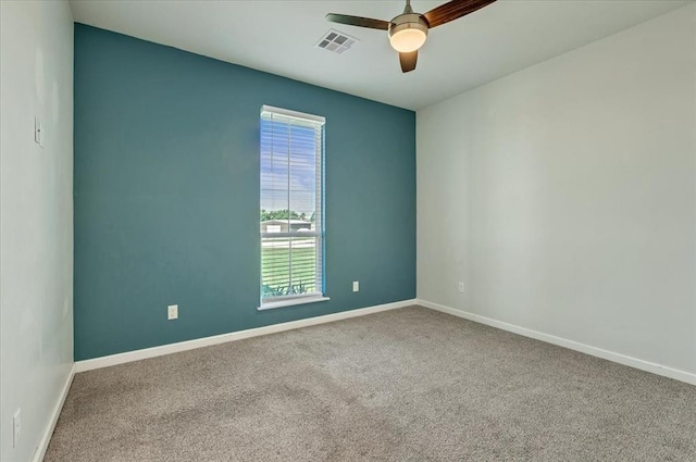1069 Rheagen Kay Ave, Tuttle, OK 73089 - carpeted spare room featuring ceiling fan and baseboards