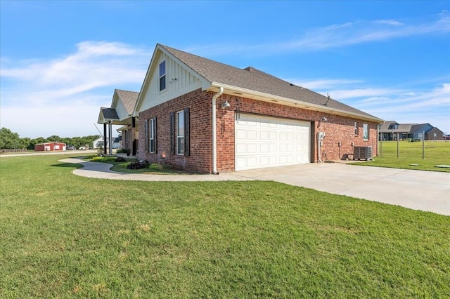 1069 Rheagen Kay Ave, Tuttle, OK 73089 - view of home's exterior featuring concrete driveway, brick siding, an attached garage, and a yard