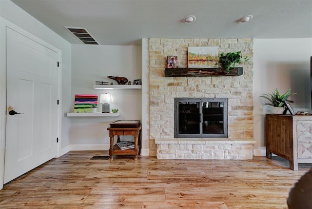 12629 Teakwood Rd, Oklahoma City, OK 73013 - living room featuring a stone fireplace and wood finished floors