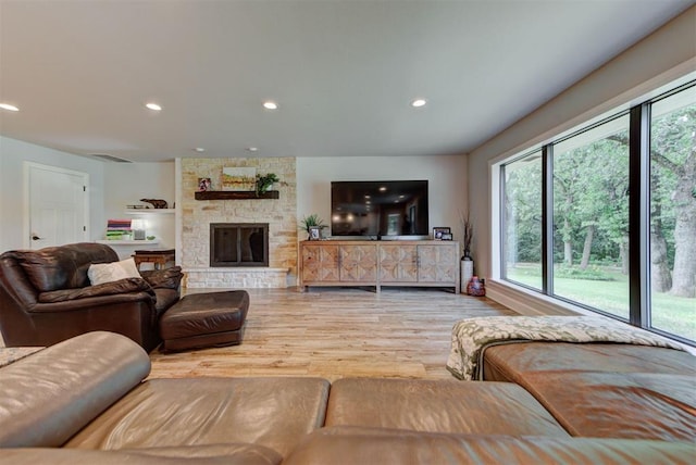 12629 Teakwood Rd, Oklahoma City, OK 73013 - living area with wood finished floors, recessed lighting, and a stone fireplace