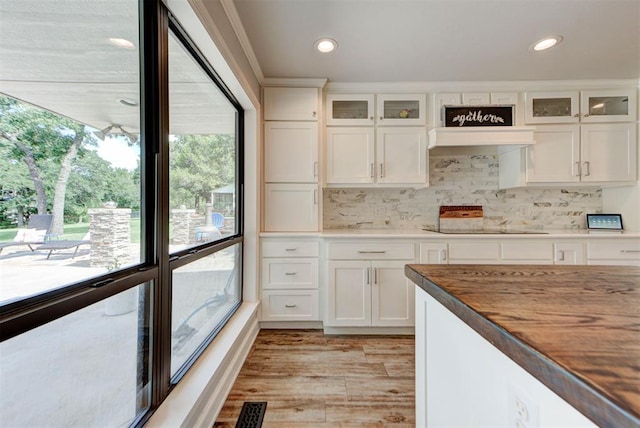 12629 Teakwood Rd, Oklahoma City, OK 73013 - kitchen with light wood-style flooring, white cabinets, recessed lighting, and tasteful backsplash