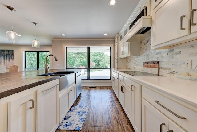 12629 Teakwood Rd, Oklahoma City, OK 73013 - kitchen featuring black electric stovetop, dark wood-style floors, butcher block counters, recessed lighting, and dishwasher