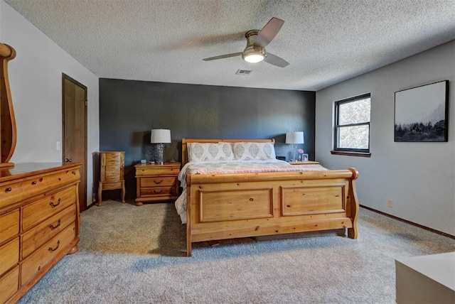12629 Teakwood Rd, Oklahoma City, OK 73013 - bedroom with light carpet, ceiling fan, and a textured ceiling