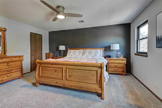 12629 Teakwood Rd, Oklahoma City, OK 73013 - bedroom with light colored carpet, a textured ceiling, and a ceiling fan