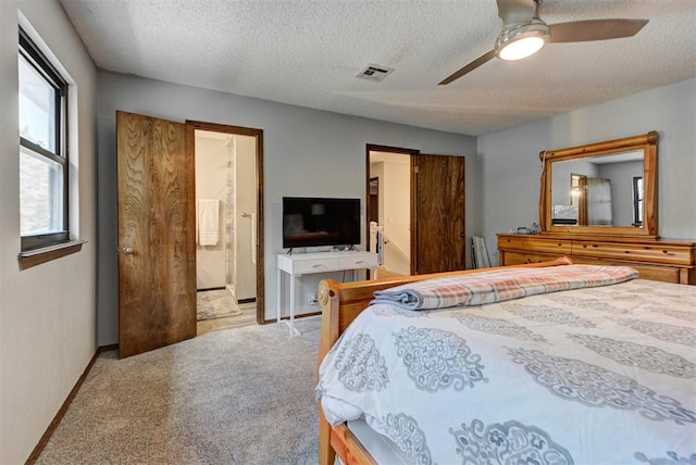 12629 Teakwood Rd, Oklahoma City, OK 73013 - carpeted bedroom featuring a textured ceiling, ceiling fan, and ensuite bathroom