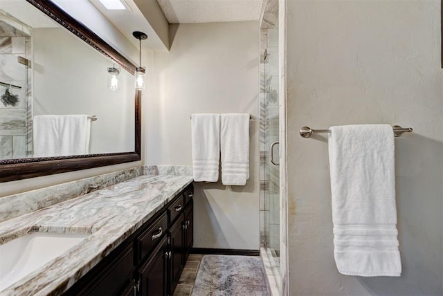 12629 Teakwood Rd, Oklahoma City, OK 73013 - full bath featuring double vanity, a stall shower, and a textured ceiling