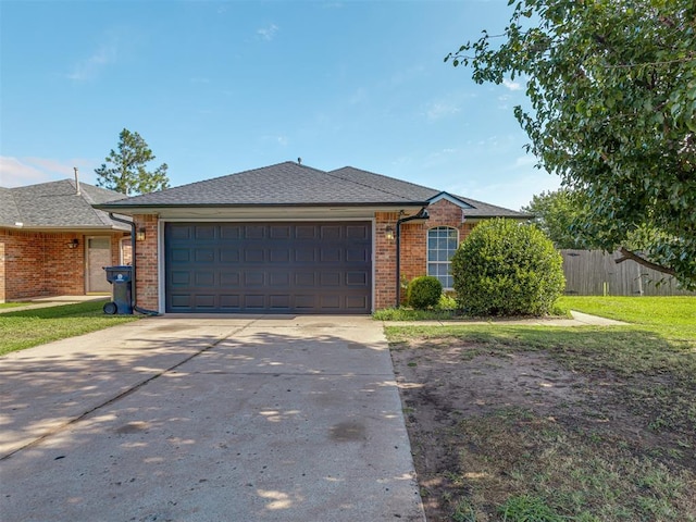 629 NW 121st St, Oklahoma City, OK 73114 - ranch-style home with an attached garage, brick siding, concrete driveway, and roof with shingles