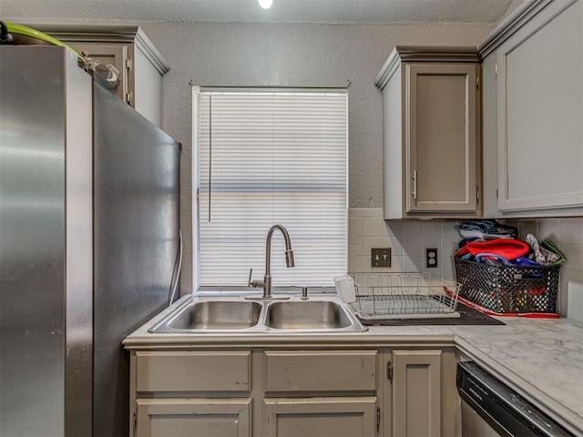 629 NW 121st St, Oklahoma City, OK 73114 - kitchen with appliances with stainless steel finishes, backsplash, light countertops, and a textured wall