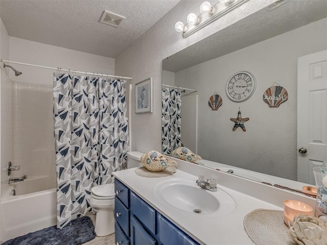 629 NW 121st St, Oklahoma City, OK 73114 - bathroom with a textured wall, vanity, shower / bath combo with shower curtain, and a textured ceiling