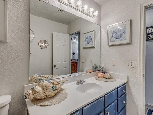 629 NW 121st St, Oklahoma City, OK 73114 - bathroom with a textured wall and vanity