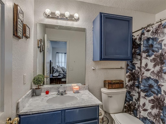 629 NW 121st St, Oklahoma City, OK 73114 - bathroom featuring a textured wall, vanity, a shower with shower curtain, and a textured ceiling
