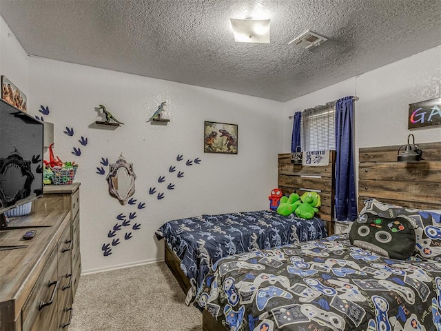 629 NW 121st St, Oklahoma City, OK 73114 - bedroom featuring carpet floors and a textured ceiling