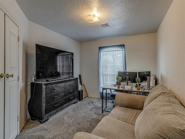 629 NW 121st St, Oklahoma City, OK 73114 - carpeted living room with a textured ceiling and an office area