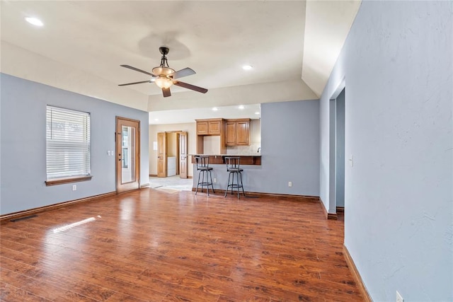 10516 NW 16th St, Yukon, OK 73099 - unfurnished living room featuring ceiling fan, wood finished floors, recessed lighting, and vaulted ceiling