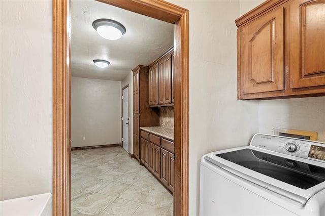 10516 NW 16th St, Yukon, OK 73099 - washroom featuring washer / clothes dryer and cabinet space