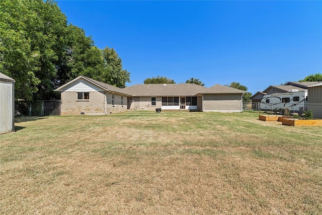 10516 NW 16th St, Yukon, OK 73099 - view of front of house featuring a vegetable garden and brick siding