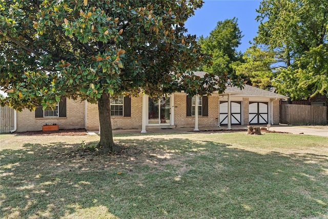 10516 NW 16th St, Yukon, OK 73099 - view of front of house featuring brick siding and driveway