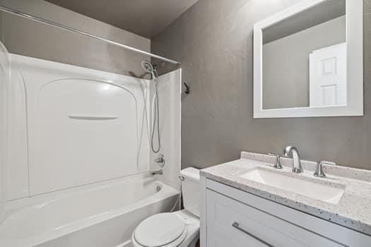 2709 NW 184th St, Edmond, OK 73012 - bathroom with vanity and washtub / shower combination