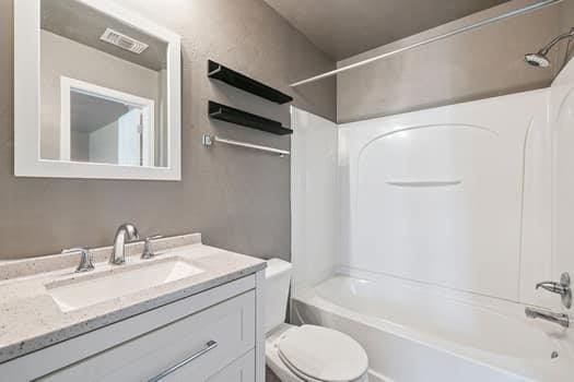 2709 NW 184th St, Edmond, OK 73012 - bathroom with vanity and washtub / shower combination