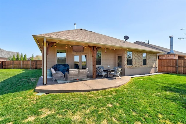 3937 NW 167th Ter, Edmond, OK 73012 - back of house with a fenced backyard, a shingled roof, a patio, and outdoor lounge area