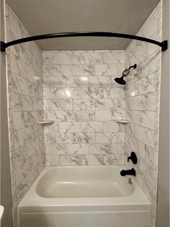 1412 NW 96th St, Oklahoma City, OK 73114 - bathroom featuring a textured ceiling and tub / shower combination