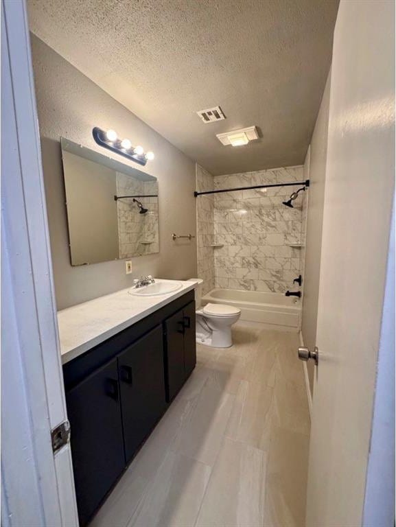 1412 NW 96th St, Oklahoma City, OK 73114 - bathroom with a textured ceiling, vanity, and washtub / shower combination