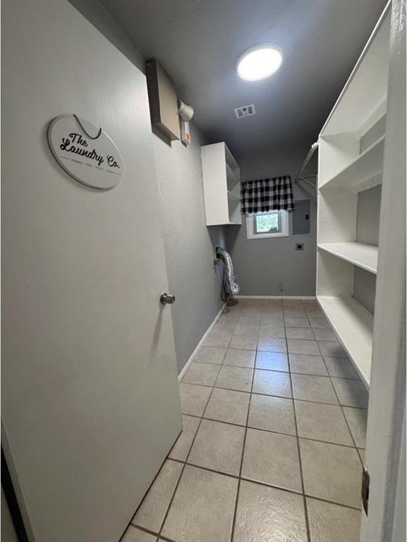 1412 NW 96th St, Oklahoma City, OK 73114 - laundry area featuring light tile patterned floors, electric panel, and hookup for an electric dryer