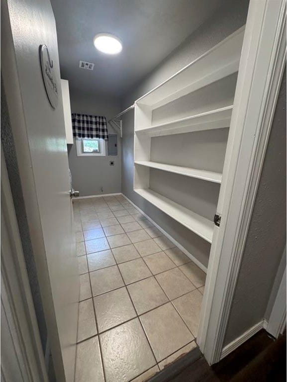 1412 NW 96th St, Oklahoma City, OK 73114 - walk in closet featuring light tile patterned floors