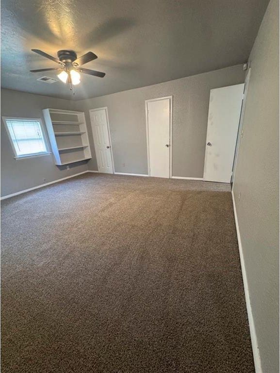 1412 NW 96th St, Oklahoma City, OK 73114 - unfurnished room with a ceiling fan, carpet flooring, and a textured ceiling