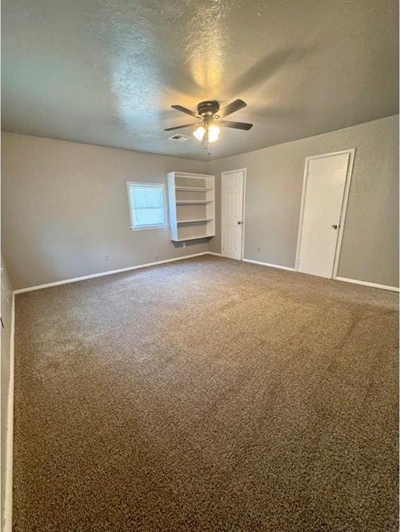 1412 NW 96th St, Oklahoma City, OK 73114 - unfurnished room featuring ceiling fan, a textured ceiling, and carpet