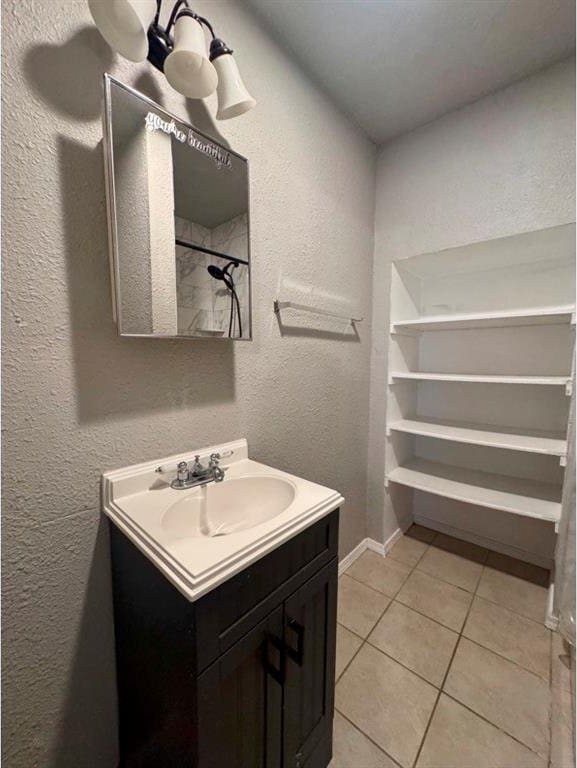 1412 NW 96th St, Oklahoma City, OK 73114 - bathroom with vanity, tile patterned flooring, and a textured wall