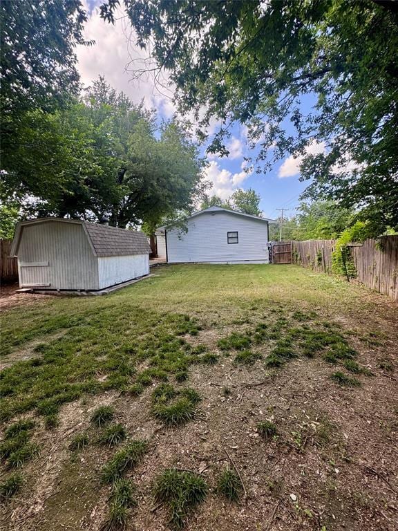 1412 NW 96th St, Oklahoma City, OK 73114 - fenced backyard featuring a storage unit