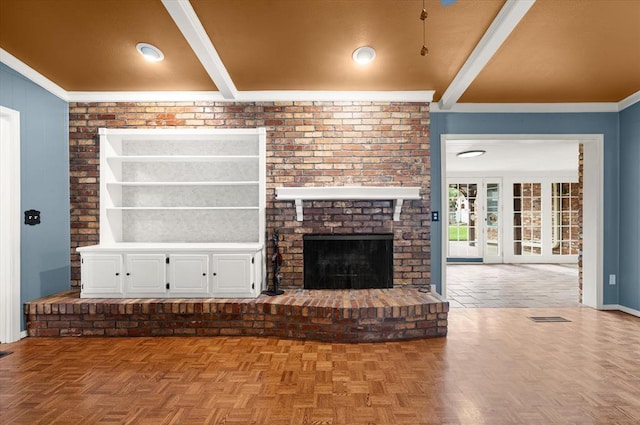 2805 Tudor Rd, Oklahoma City, OK 73127 - unfurnished living room with beamed ceiling, crown molding, and a brick fireplace
