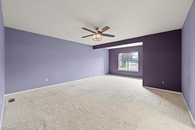 2805 Tudor Rd, Oklahoma City, OK 73127 - carpeted spare room with ceiling fan and baseboards