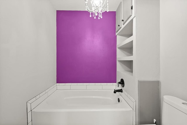 2805 Tudor Rd, Oklahoma City, OK 73127 - bathroom featuring a garden tub and a chandelier
