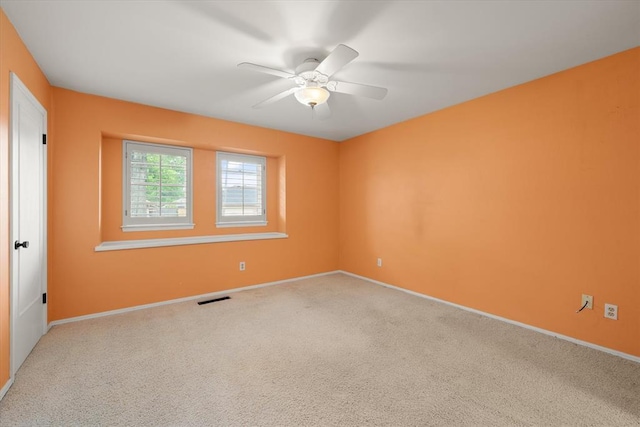 2805 Tudor Rd, Oklahoma City, OK 73127 - empty room with a ceiling fan and carpet floors