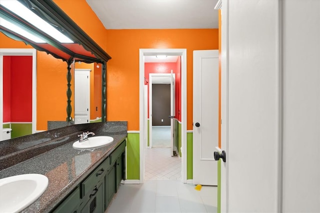 2805 Tudor Rd, Oklahoma City, OK 73127 - bathroom featuring double vanity and tile patterned flooring