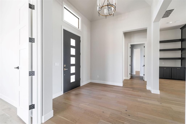 4716 Moulin Rd, Edmond, OK 73034 - foyer featuring a chandelier and light wood-type flooring