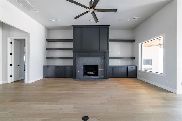 4716 Moulin Rd, Edmond, OK 73034 - unfurnished living room with ceiling fan, light wood finished floors, a premium fireplace, and recessed lighting