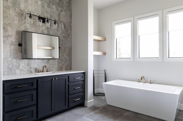 4716 Moulin Rd, Edmond, OK 73034 - bathroom with a freestanding tub, vanity, and tile patterned floors