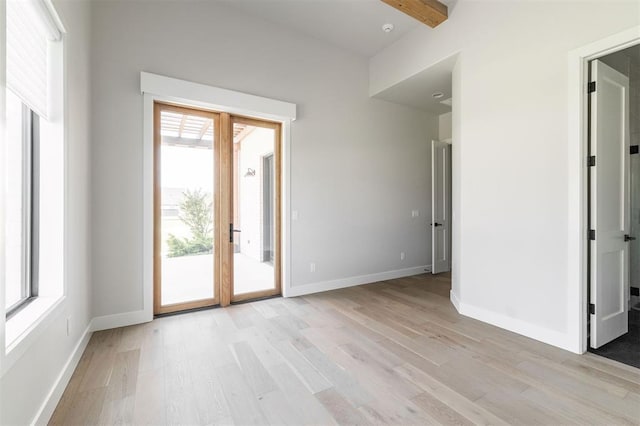 4716 Moulin Rd, Edmond, OK 73034 - empty room featuring light wood-type flooring and beamed ceiling