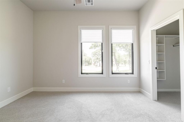 4716 Moulin Rd, Edmond, OK 73034 - spare room with light carpet and a ceiling fan
