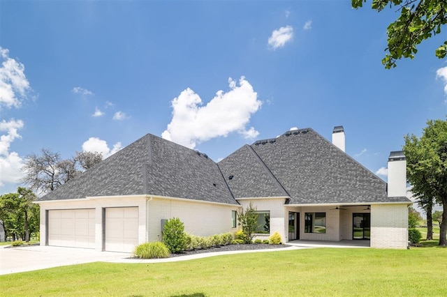 4716 Moulin Rd, Edmond, OK 73034 - view of front of property featuring brick siding, a chimney, an attached garage, a front yard, and a shingled roof