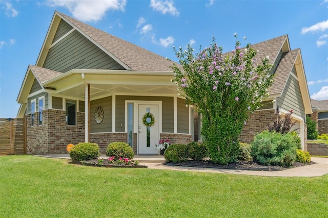 637 NW 179th Cir, Edmond, OK 73012 - craftsman-style house featuring brick siding, a front yard, and a shingled roof