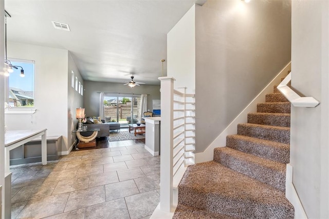 637 NW 179th Cir, Edmond, OK 73012 - staircase featuring a ceiling fan and baseboards