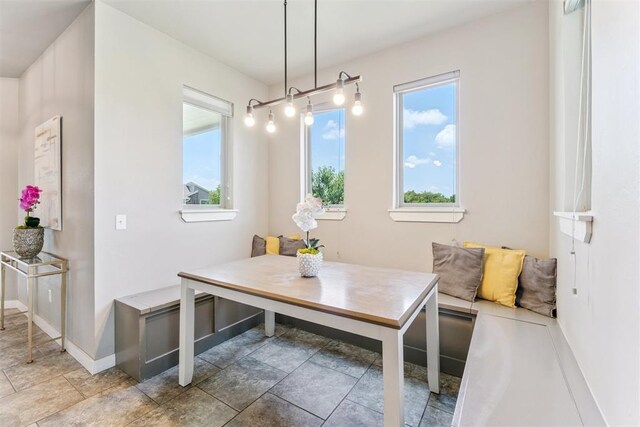 637 NW 179th Cir, Edmond, OK 73012 - dining room featuring plenty of natural light, breakfast area, and stone finish floors