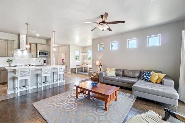 637 NW 179th Cir, Edmond, OK 73012 - living room featuring a ceiling fan and dark wood-style flooring