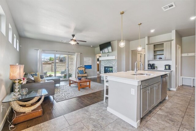 637 NW 179th Cir, Edmond, OK 73012 - kitchen with open floor plan, gray cabinetry, light countertops, and open shelves